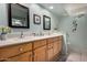 Bathroom featuring double sink vanity with generous storage space and light countertops at 5830 E Mckellips Rd # 120, Mesa, AZ 85215