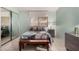 Bright bedroom with tile floors, queen bed, mirrored closet doors, and ample natural light at 5830 E Mckellips Rd # 120, Mesa, AZ 85215