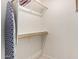 Walk-in closet with shelving, clothing racks, and an ironing board at 5830 E Mckellips Rd # 120, Mesa, AZ 85215