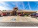 Charming clubhouse featuring ample parking, accessible entrances, and vibrant landscaping at 5830 E Mckellips Rd # 120, Mesa, AZ 85215