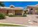 Charming exterior of a beige home with a covered porch and desert landscaping at 5830 E Mckellips Rd # 120, Mesa, AZ 85215