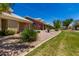 Well-maintained home exterior with lush lawn and desert landscaping at 5830 E Mckellips Rd # 120, Mesa, AZ 85215