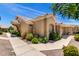 Side view of charming single-story home featuring desert landscape at 5830 E Mckellips Rd # 120, Mesa, AZ 85215