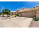 Charming single-story home featuring a desert landscape, tile roof and an attached two-car garage at 5830 E Mckellips Rd # 120, Mesa, AZ 85215