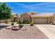 Charming single-story home featuring a desert landscape, tile roof and an attached two-car garage at 5830 E Mckellips Rd # 120, Mesa, AZ 85215