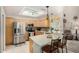 Bright kitchen featuring stainless steel appliances, light wood cabinets, and a breakfast bar with seating at 5830 E Mckellips Rd # 120, Mesa, AZ 85215