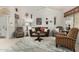 Comfortable living room featuring a ceiling fan, tile flooring, and unique wall decor at 5830 E Mckellips Rd # 120, Mesa, AZ 85215