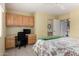 Comfortable main bedroom features a dedicated desk, ceiling fan and closet at 5830 E Mckellips Rd # 120, Mesa, AZ 85215