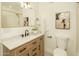 Updated bathroom features modern vanity with marble countertop and stylish fixtures at 628 N Hobson --, Mesa, AZ 85203