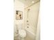 Bathroom features a shower over tub with a modern shower head, and a low-flow toilet at 628 N Hobson --, Mesa, AZ 85203