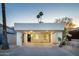 Charming home featuring a covered carport, desert landscaping, and a stylish front door at 628 N Hobson --, Mesa, AZ 85203