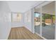 Bright bedroom with new flooring, large windows, and glass slider to back patio at 635 N 67Th Pl, Mesa, AZ 85205