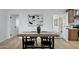 Dining room that has hardwood floors and opens up to the kitchen and the front room at 635 N 67Th Pl, Mesa, AZ 85205