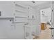 Laundry room with ample shelving and white cabinets at 635 N 67Th Pl, Mesa, AZ 85205