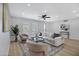 Comfortable living room with stylish decor, featuring hardwood floors, recessed lights, and neutral-toned furniture at 635 N 67Th Pl, Mesa, AZ 85205