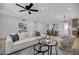 Spacious living room with lots of light, an open floor plan, and stylish modern décor at 635 N 67Th Pl, Mesa, AZ 85205