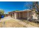 Back exterior view showing covered patio and block wall at 649 S Temple St, Mesa, AZ 85204