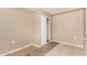 An empty bedroom features tile flooring and a bi-fold door closet at 649 S Temple St, Mesa, AZ 85204