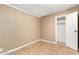 This bedroom has tile floors and neutral walls with a bright white closet at 649 S Temple St, Mesa, AZ 85204