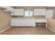 Compact kitchen with white cabinets, lots of counter space, and tile floors at 649 S Temple St, Mesa, AZ 85204