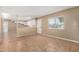 Open-concept living room with tile floors, a connecting kitchen, and a view to the outside at 649 S Temple St, Mesa, AZ 85204