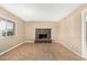 Bright living room with a fireplace, large windows, and neutral colors at 649 S Temple St, Mesa, AZ 85204