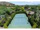 Aerial view of a private tennis court surrounded by lush landscaping at 6624 N 66Th N Pl, Paradise Valley, AZ 85253