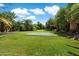 Backyard with putting green, lush landscaping and mature palm trees at 6624 N 66Th N Pl, Paradise Valley, AZ 85253