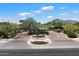 View of the community entrance and gate, Judson, with manicured landscaping at 6624 N 66Th N Pl, Paradise Valley, AZ 85253