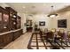 Elegant dining room with a decorative chandelier, custom built-ins, and views into the kitchen at 6624 N 66Th N Pl, Paradise Valley, AZ 85253