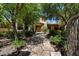 Charming front entrance with stone pathway and lush landscaping at 6624 N 66Th N Pl, Paradise Valley, AZ 85253
