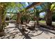 Outdoor patio with pergola, ceiling fan, and comfortable seating area at 6624 N 66Th N Pl, Paradise Valley, AZ 85253