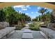 Beautiful view of a swimming pool and landscaping, as seen from a covered outdoor lounge area at 6624 N 66Th N Pl, Paradise Valley, AZ 85253