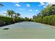 Well-maintained tennis court surrounded by lush greenery at 6624 N 66Th N Pl, Paradise Valley, AZ 85253