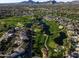Breathtaking aerial view of a golf course community featuring lush green fairways and beautiful homes at 7222 E Gainey Ranch Rd # 241, Scottsdale, AZ 85258