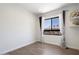 Empty Bedroom with a large window, modern curtains, and hardwood floors at 7222 E Gainey Ranch Rd # 241, Scottsdale, AZ 85258