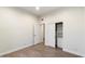 Bedroom with wood floors and closet with built-in shelving at 7222 E Gainey Ranch Rd # 241, Scottsdale, AZ 85258