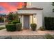 Charming home exterior featuring a landscaped front yard with gray front door and tile roof at 7222 E Gainey Ranch Rd # 241, Scottsdale, AZ 85258