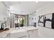 Kitchen with white farmhouse sink, stainless appliances, and balcony access at 7222 E Gainey Ranch Rd # 241, Scottsdale, AZ 85258