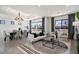 Open living space with a living room and dining area, complete with modern decor and flat-screen TV at 7222 E Gainey Ranch Rd # 241, Scottsdale, AZ 85258