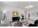 Bright living room featuring modern decor, a flat-screen TV, and comfortable seating at 7222 E Gainey Ranch Rd # 241, Scottsdale, AZ 85258