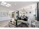 Bright living room with modern decor, chandelier, and view to dining area at 7222 E Gainey Ranch Rd # 241, Scottsdale, AZ 85258
