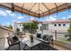 Relaxing outdoor patio featuring stylish seating, awning, and views of the community at 7222 E Gainey Ranch Rd # 241, Scottsdale, AZ 85258