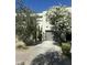 Attractive two-story home featuring mature landscaping and a two-car garage set on a well-maintained street at 7710 E Gainey Ranch Rd # 142, Scottsdale, AZ 85258