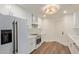 Modern kitchen features white cabinetry, stainless steel appliances, and elegant countertops at 7710 E Gainey Ranch Rd # 142, Scottsdale, AZ 85258