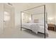A stylish main bedroom featuring a canopy bed, sleek lines and modern decor at 7710 E Gainey Ranch Rd # 142, Scottsdale, AZ 85258