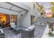 Charming patio with comfortable seating, pavers, and attractive outdoor lighting at 7710 E Gainey Ranch Rd # 142, Scottsdale, AZ 85258