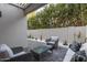 Relaxing outdoor patio with comfortable seating and stylish pavers at 7710 E Gainey Ranch Rd # 142, Scottsdale, AZ 85258