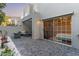 Inviting patio featuring pavers, comfortable seating, and a sliding glass door at 7710 E Gainey Ranch Rd # 142, Scottsdale, AZ 85258