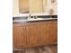 Bathroom vanity featuring updated cabinets, countertop, sink, and a large mirror at 7807 E Main St # G-23, Mesa, AZ 85207